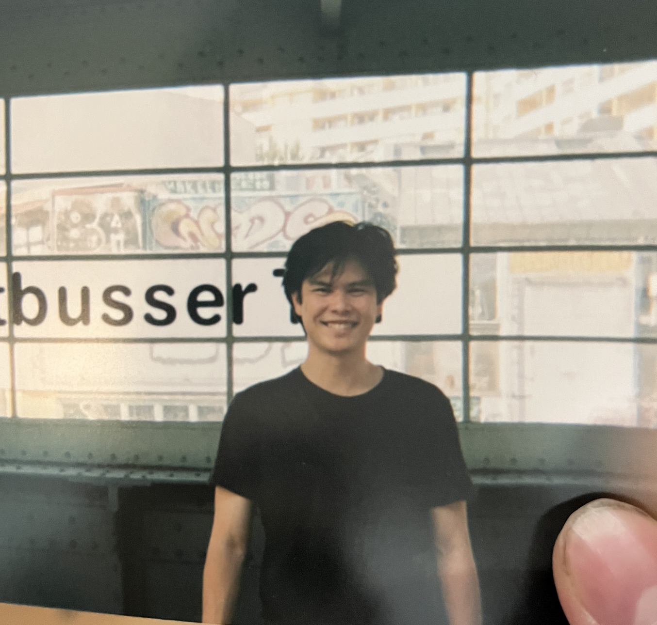 Tim smiling in a black T-shirt